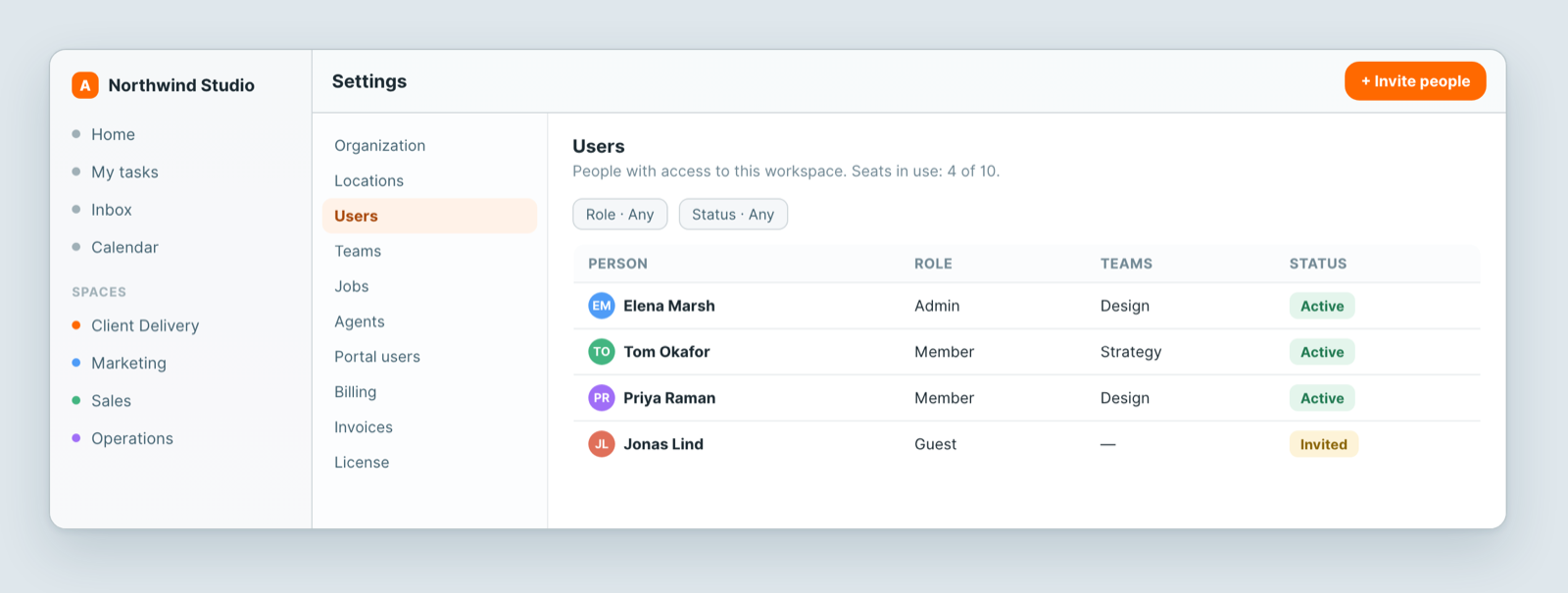 The Users screen in Settings, showing each person's role and invite status
