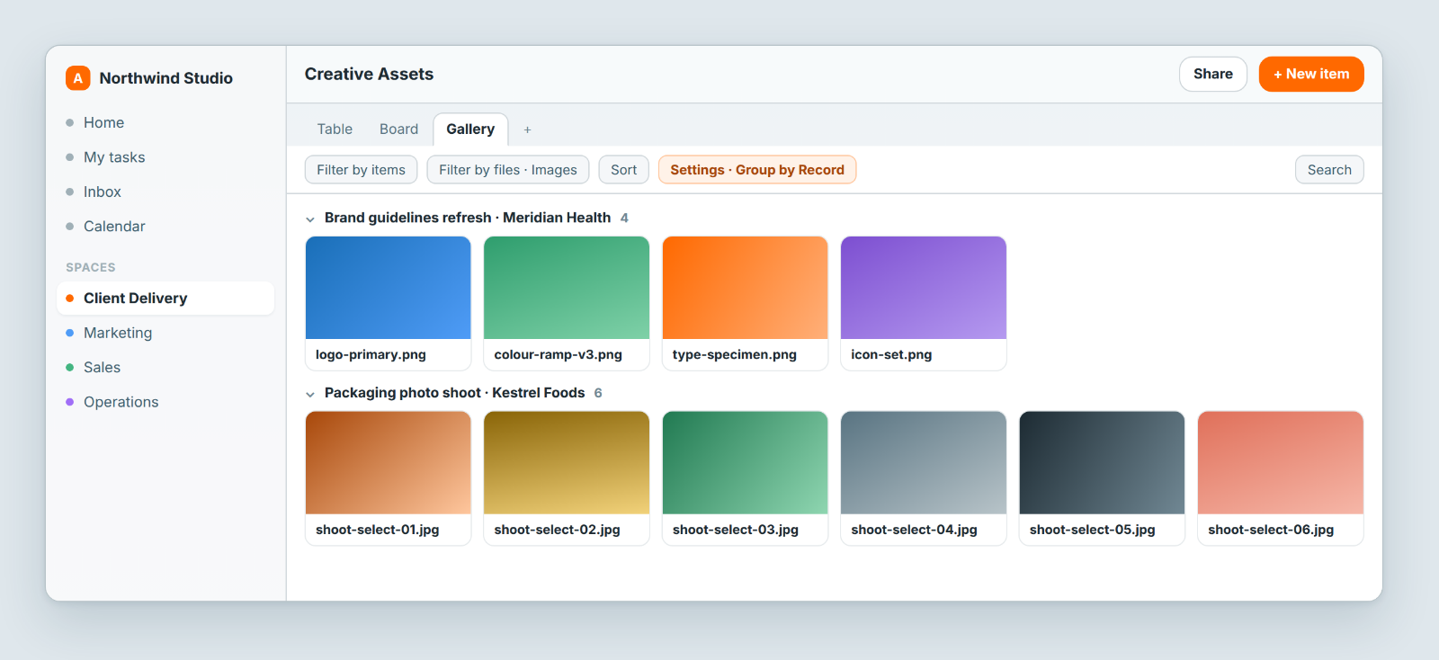 Gallery view grouped by record, showing image files from two client projects